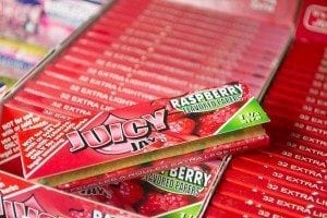 Close-Up of a pack of Juicy J Rolling Papers, Raspberry Flavor