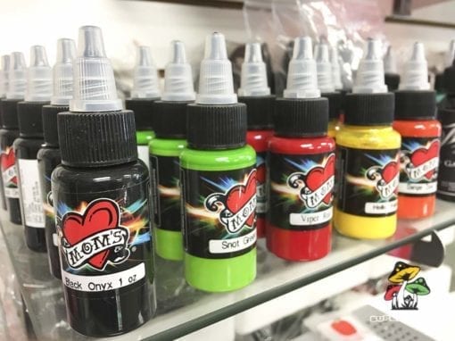 Photo of bottles of Mom's Tattoo Ink in Various colors.