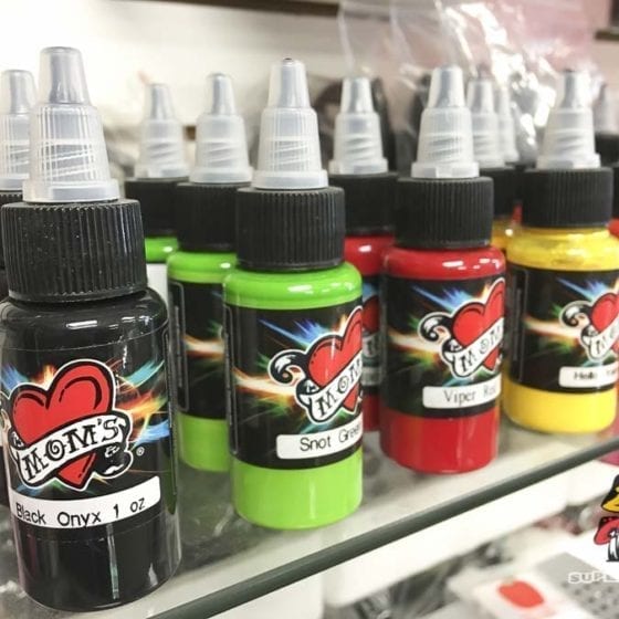 Photo of bottles of Mom's Tattoo Ink in Various colors.