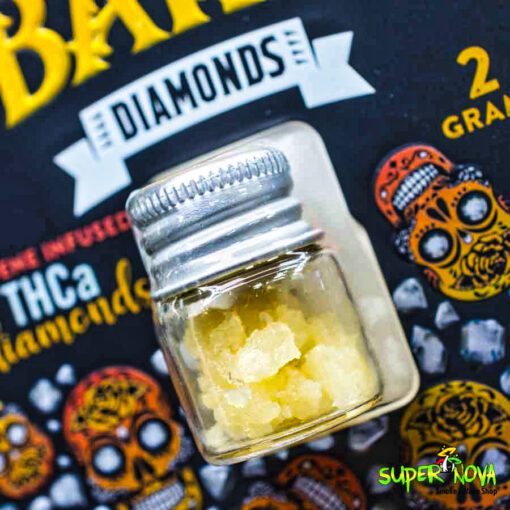Close-up view of Esco Bars THCA Diamonds in a tiny jar